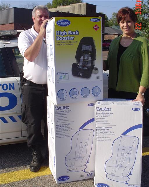 Chief Webb donates Protective Child Seats to our Local Carl Perkins Center Director Amanda Hopkins