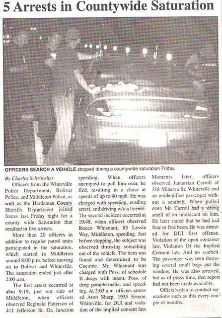 Officers search a vehicle